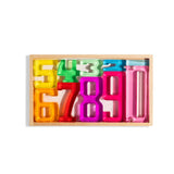 Colorful acrylic Number Blocks from 1 to 10 displayed in a wooden tray for early math learning.