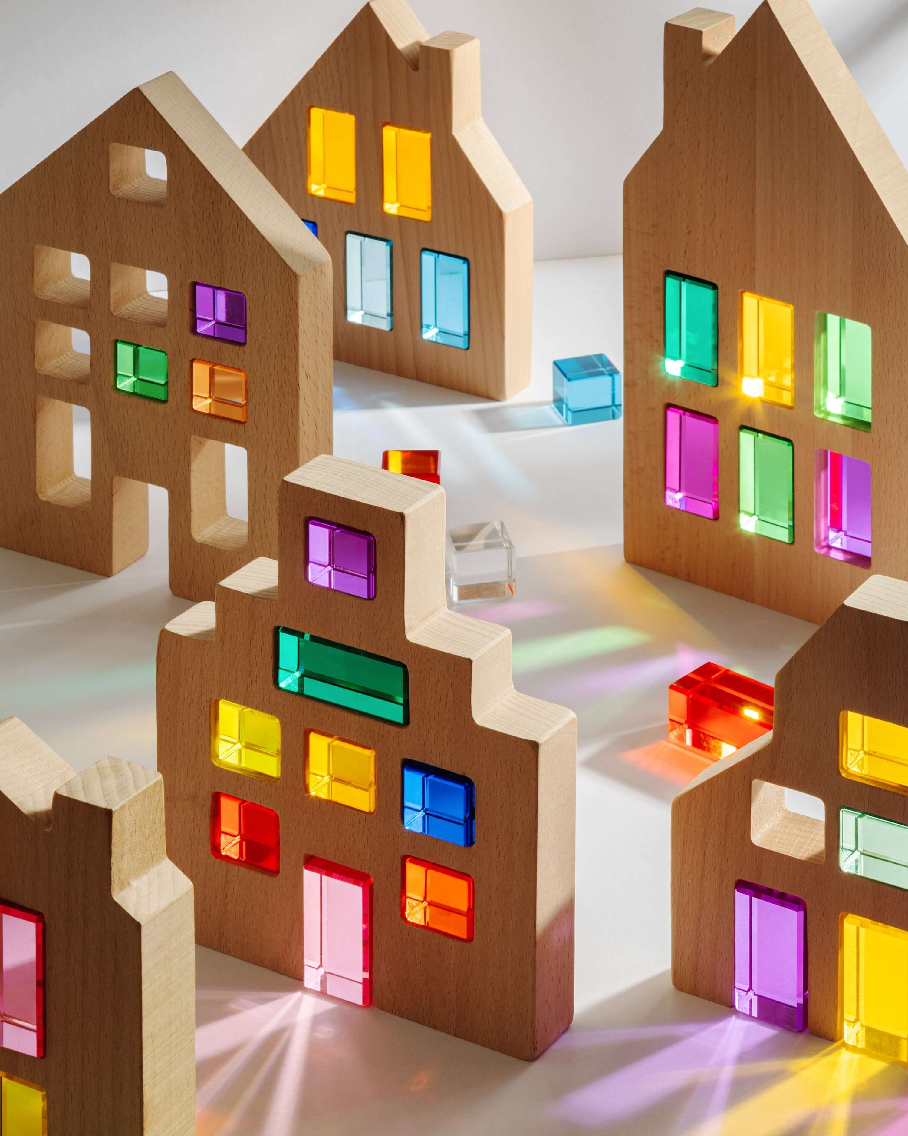 Colorful Canal House Blocks building set featuring translucent window cutouts for imaginative play.