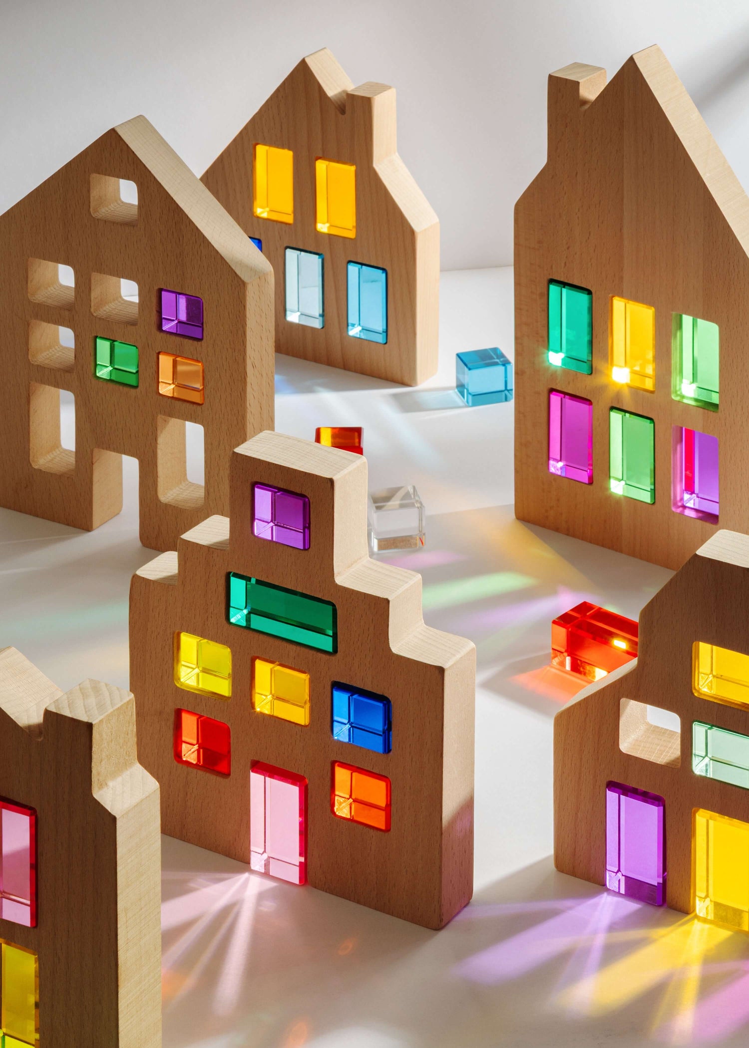 lucent acrylic gemstones reflecting light in wooden blocks