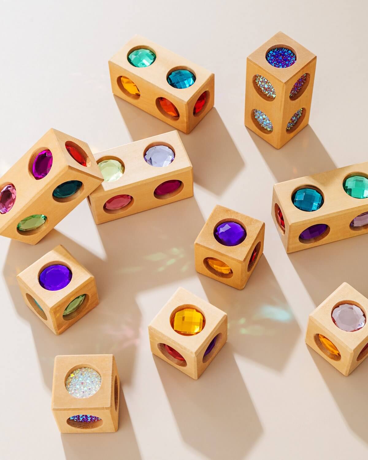 wooden gem blocks with colorful light reflections