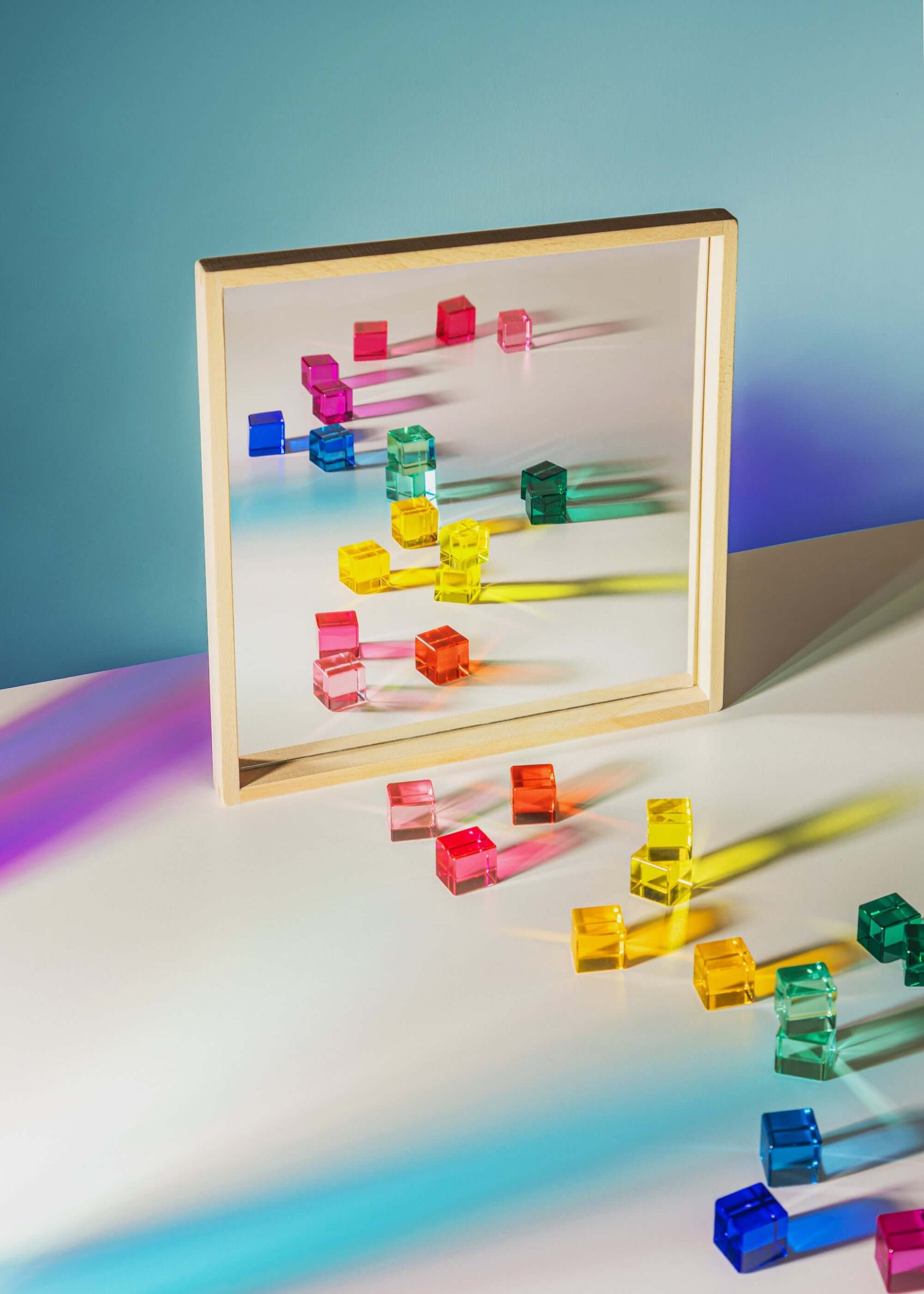 Mirror Tray showcasing colorful acrylic blocks reflecting in a smooth mirrored surface.