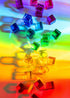 Colorful transparent cubes on a rainbow gradient background