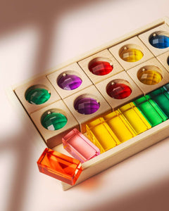 James Block Set translucent wooden blocks with colorful lucite gemstones and windows creating light and shadow play