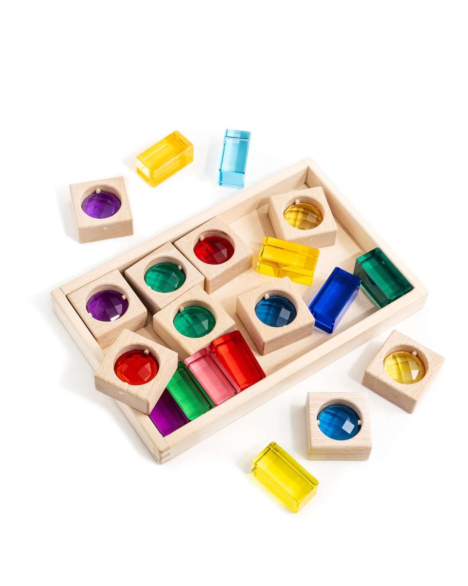 Alt Tag: James Blocks Digital Play Guide with wooden blocks and colorful translucent pieces for open-ended imaginative learning