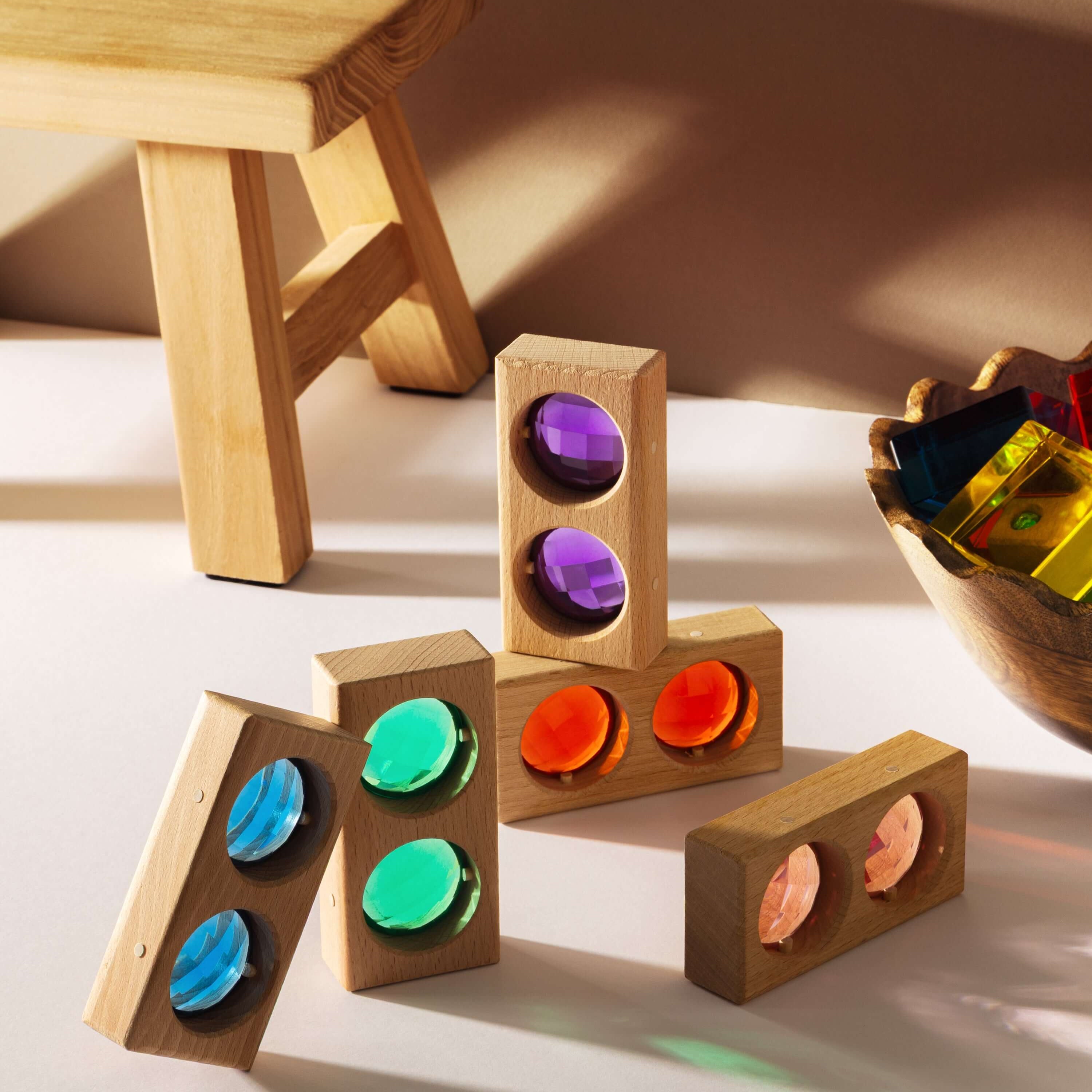 Juni Blocks - Rainbow Window Set with wooden blocks and colorful translucent acrylic inserts for imaginative play.