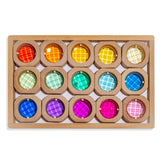 Wooden blocks with colorful round transparent windows on a white background