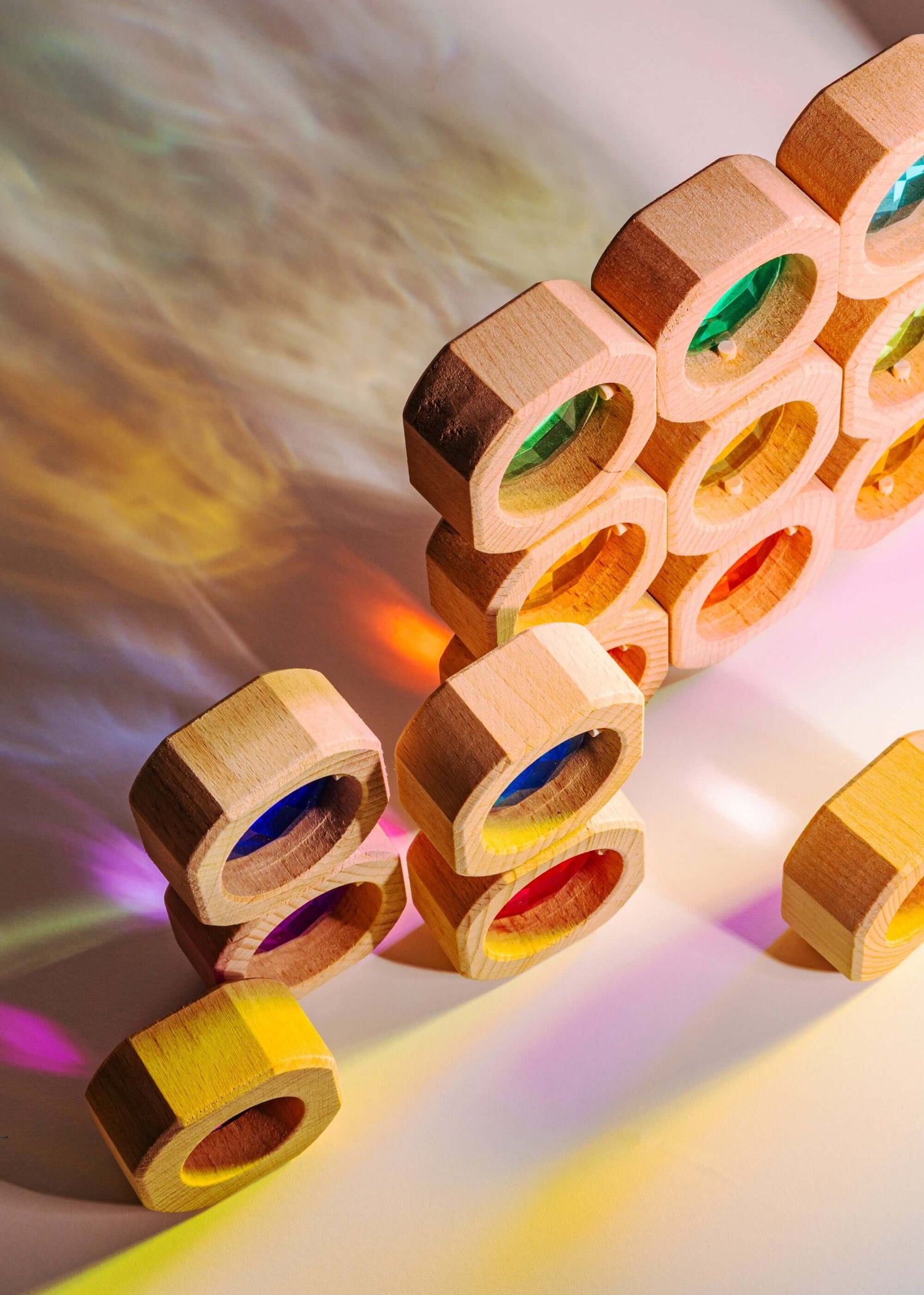 Wooden blocks with colorful acrylic windows on a gradient background