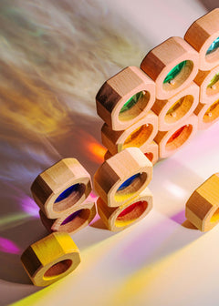 Wooden blocks with colorful acrylic windows on a gradient background