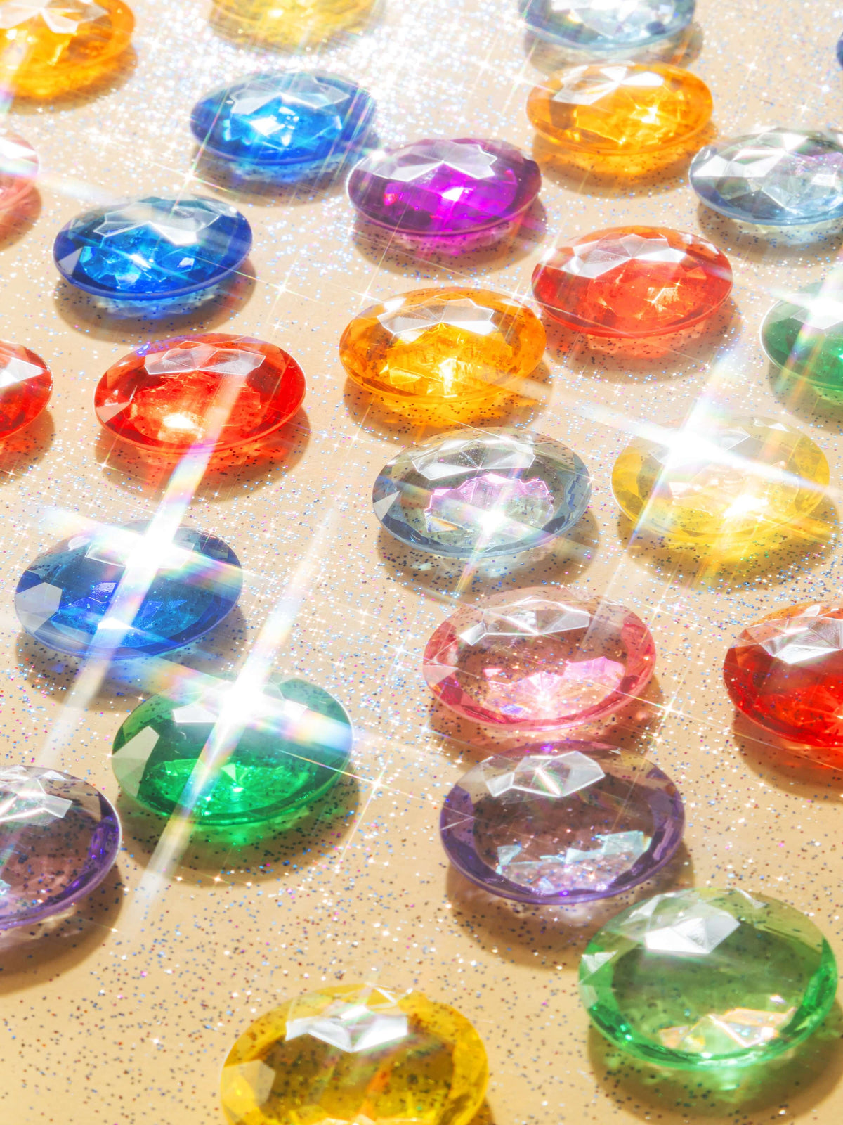Colorful array of Magic holographic acrylic gems shining with a holographic finish on a sparkling background.