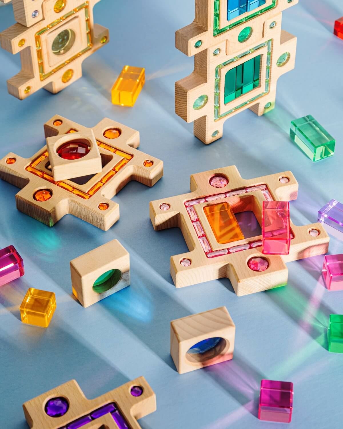 Busy Blocks wooden building set with gem-like inlays and colorful translucent cubes, interlocking shapes for creative kids play