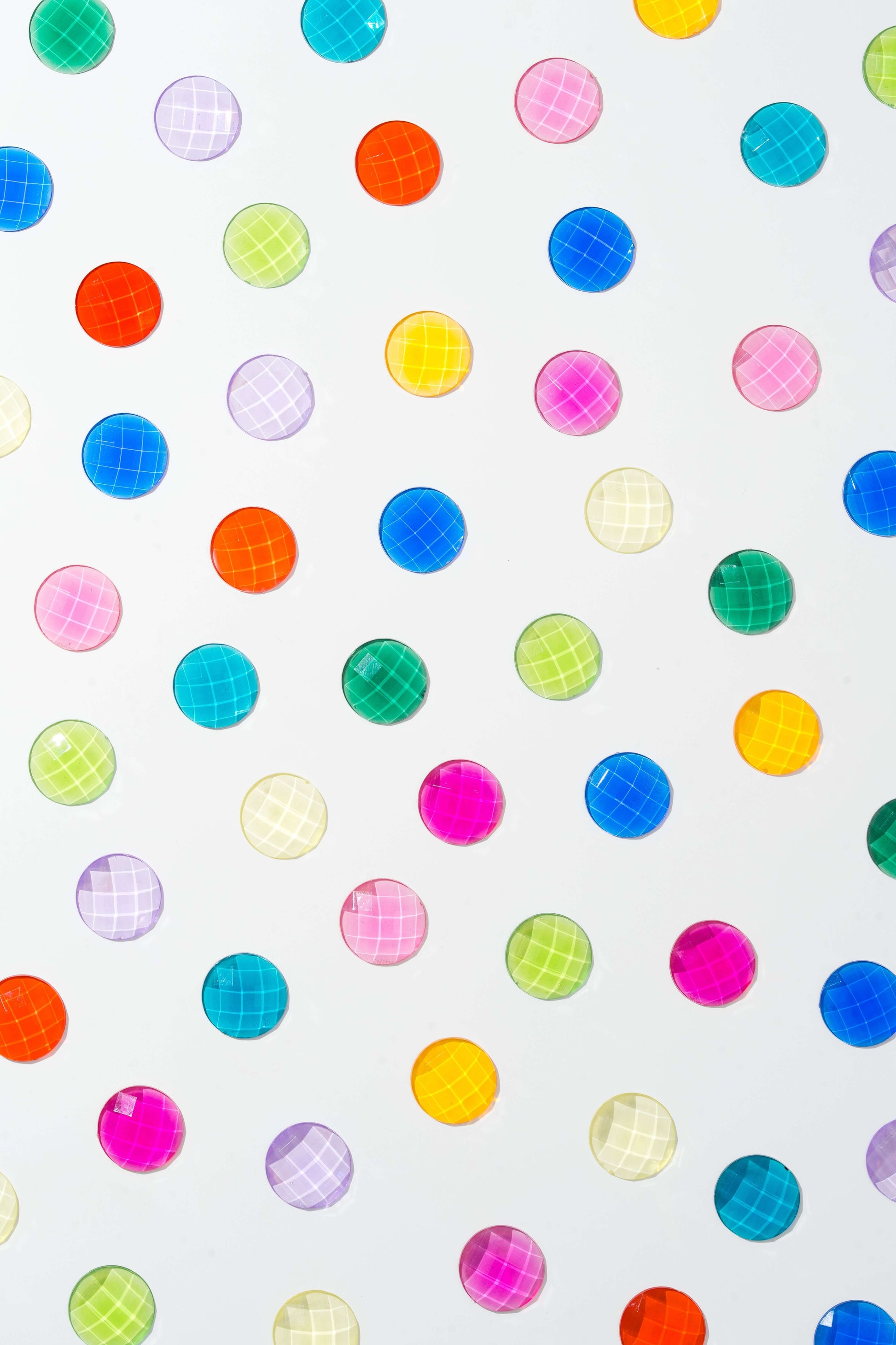 child sorting colorful acrylic sensory gems