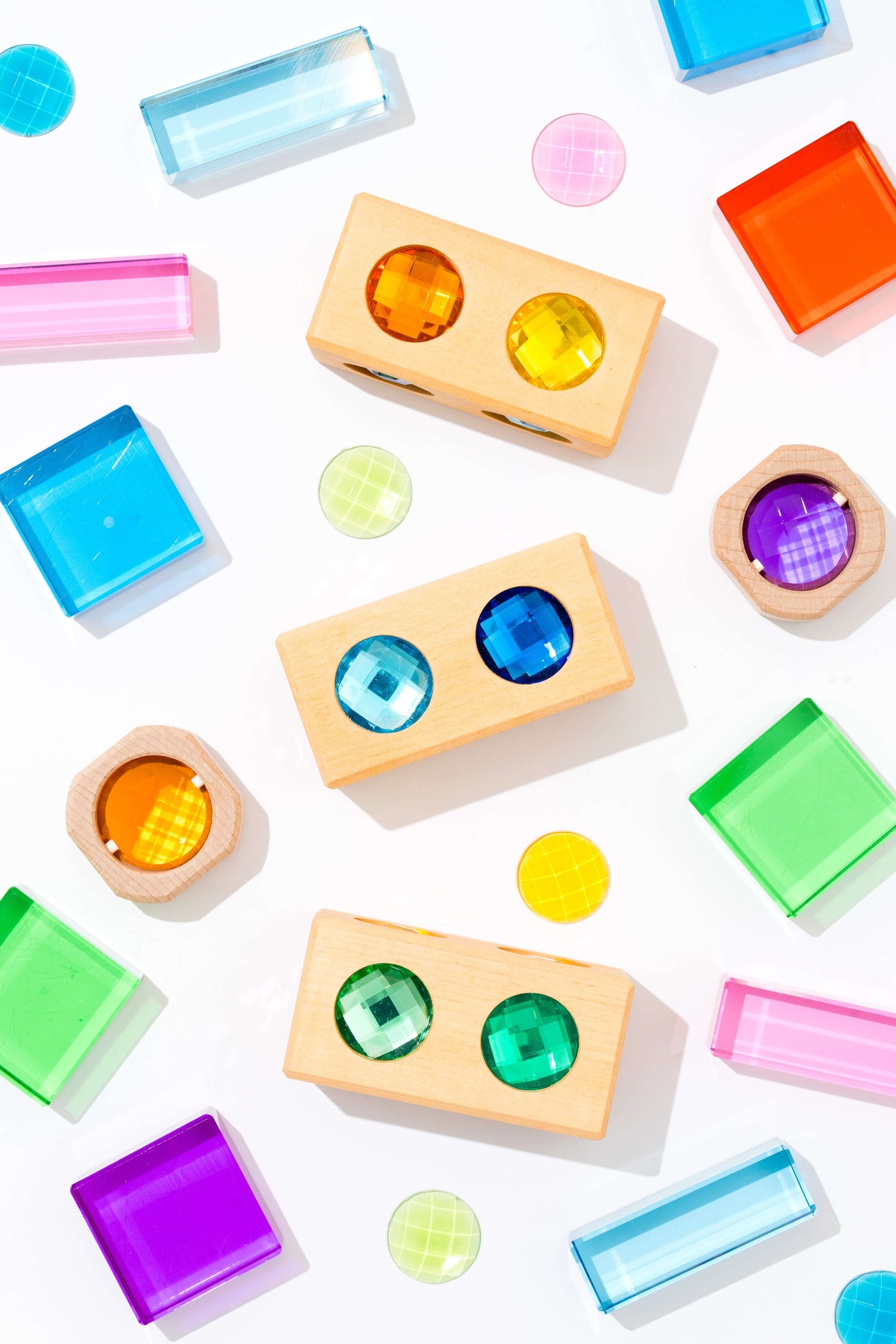 Theo Blocks crystal-clear acrylic square blocks and colorful light discs for open-ended stacking, sorting, and color play