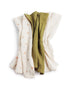 Pomme Burp Cloths set of three organic cotton muslin cloths in neutral and green colors, perfect for modern parents.