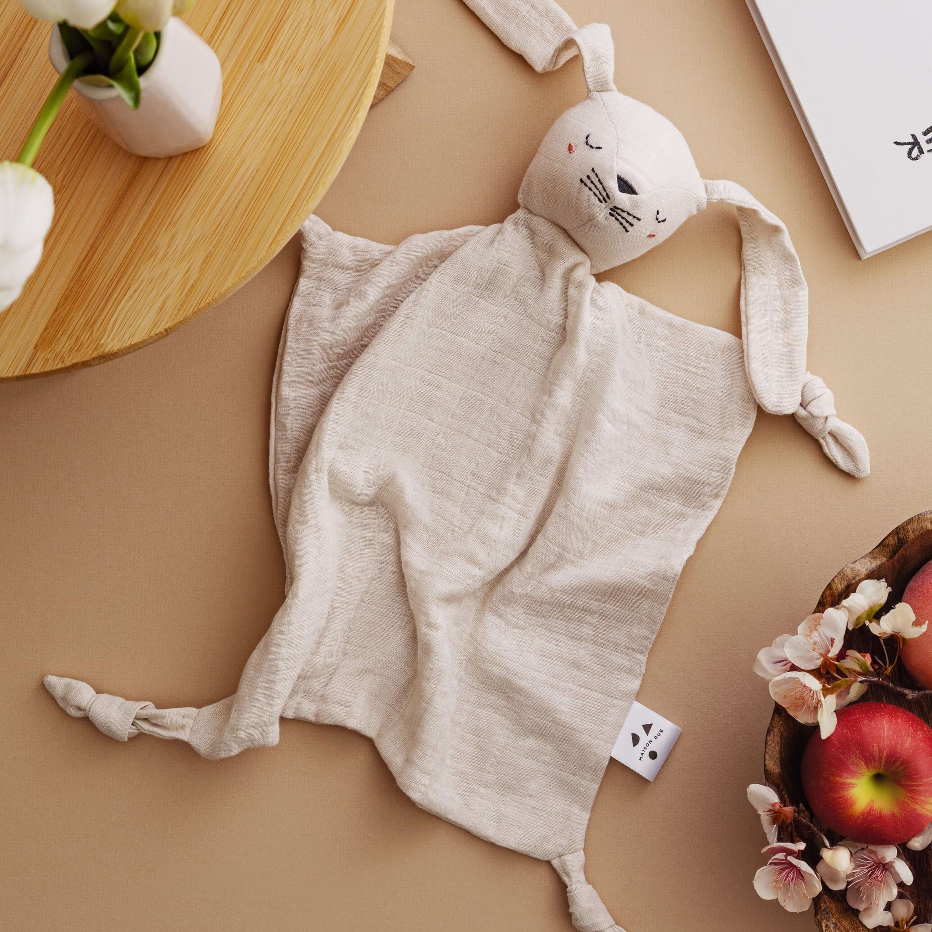 Soft Pocket Pals bunny comforter with floppy ears, perfect for comforting babies during adventures.