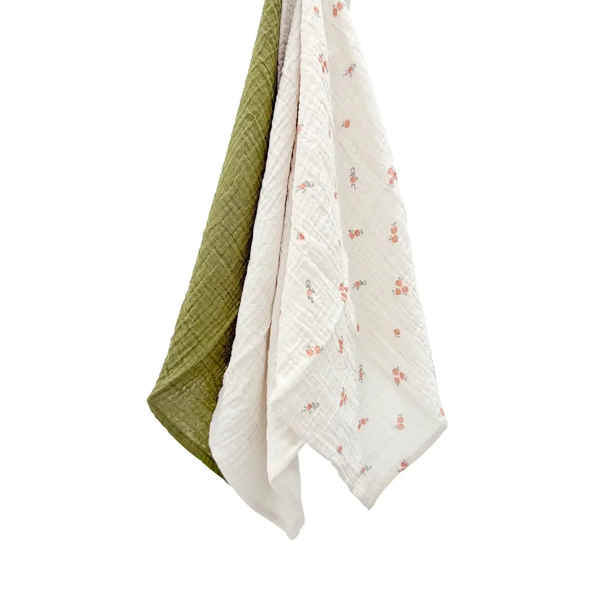 Pomme Burp Cloths featuring three organic cotton muslin cloths in green, white, and floral patterns.