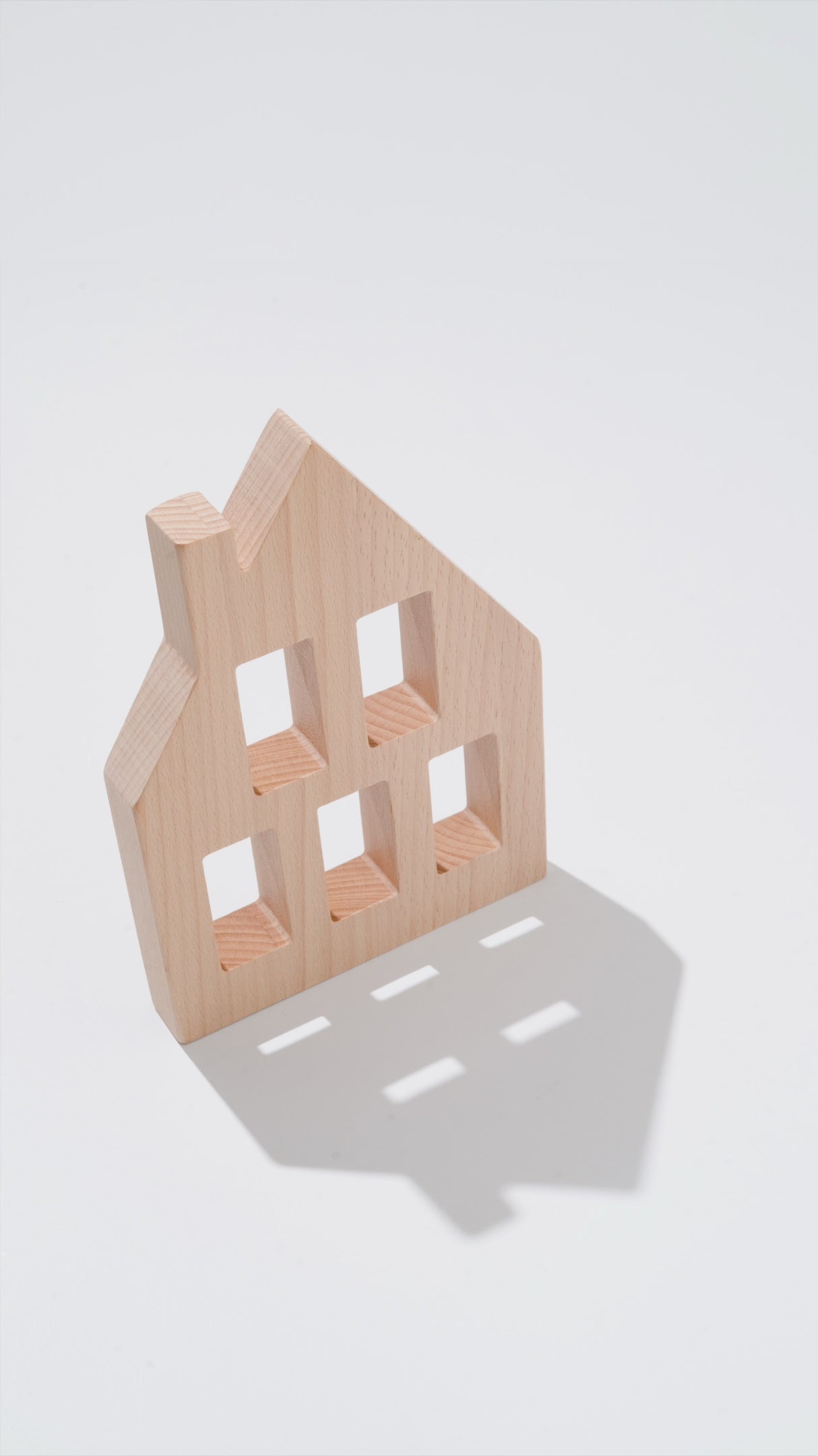Canal House Blocks wooden canal house building block with window cutouts, natural wood silhouette on white background