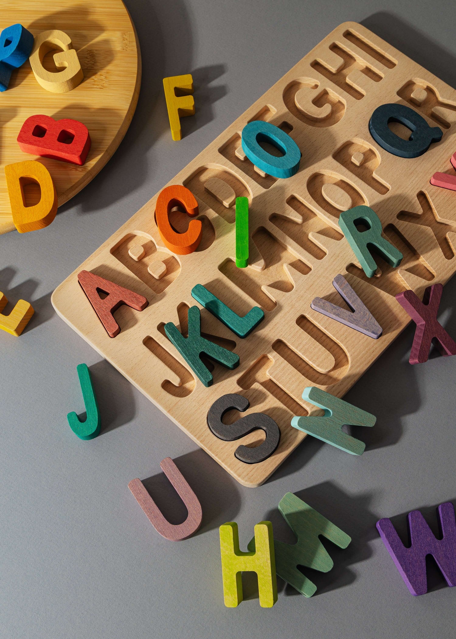 Colorful educational puzzle set featuring uppercase letters for hands-on learning and play.