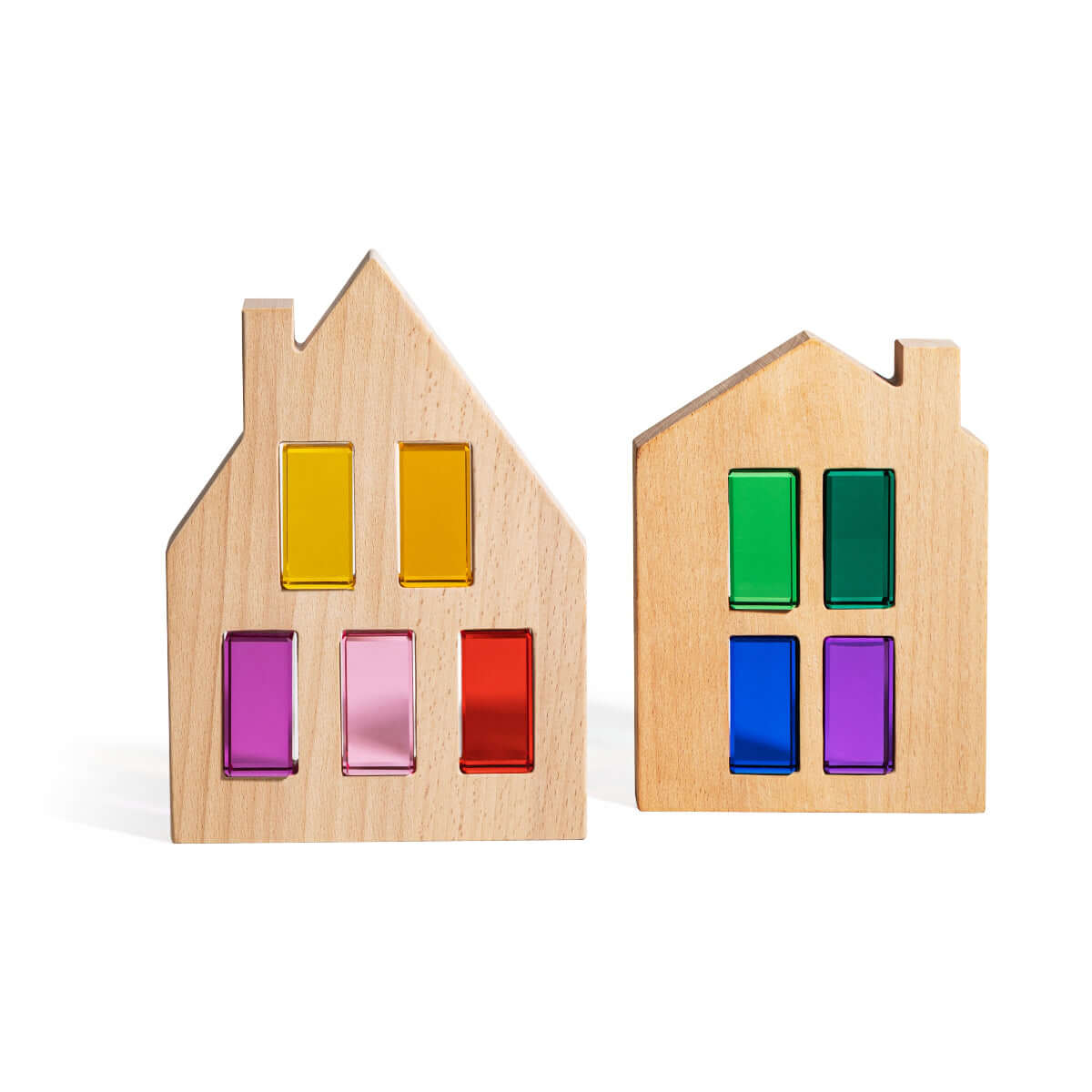 Two wooden house-shaped toys with colorful rectangular windows on a white background