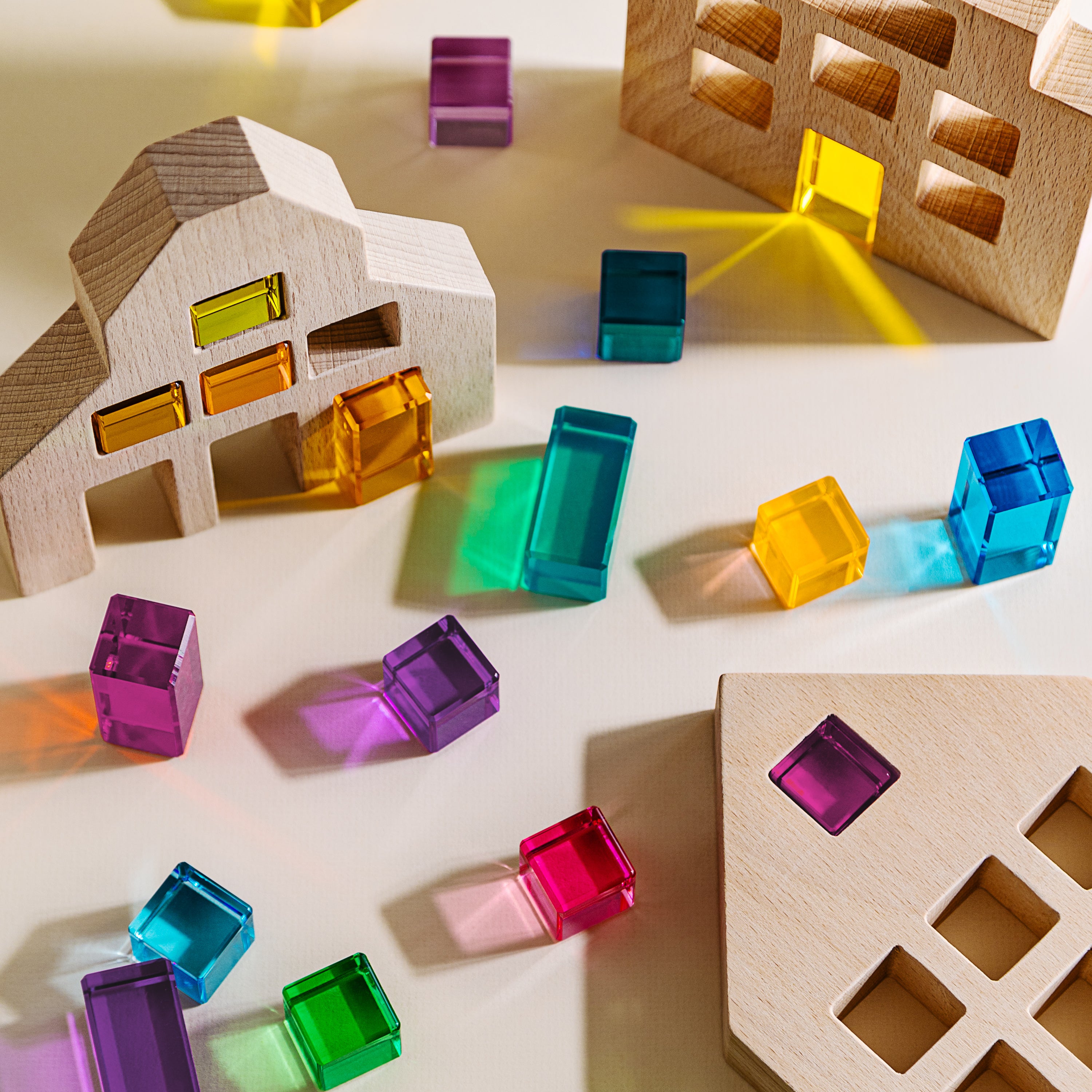 Alt Tag: Riley Blocks Digital Play Guide wooden block shapes with colorful translucent cubes for creative learning play