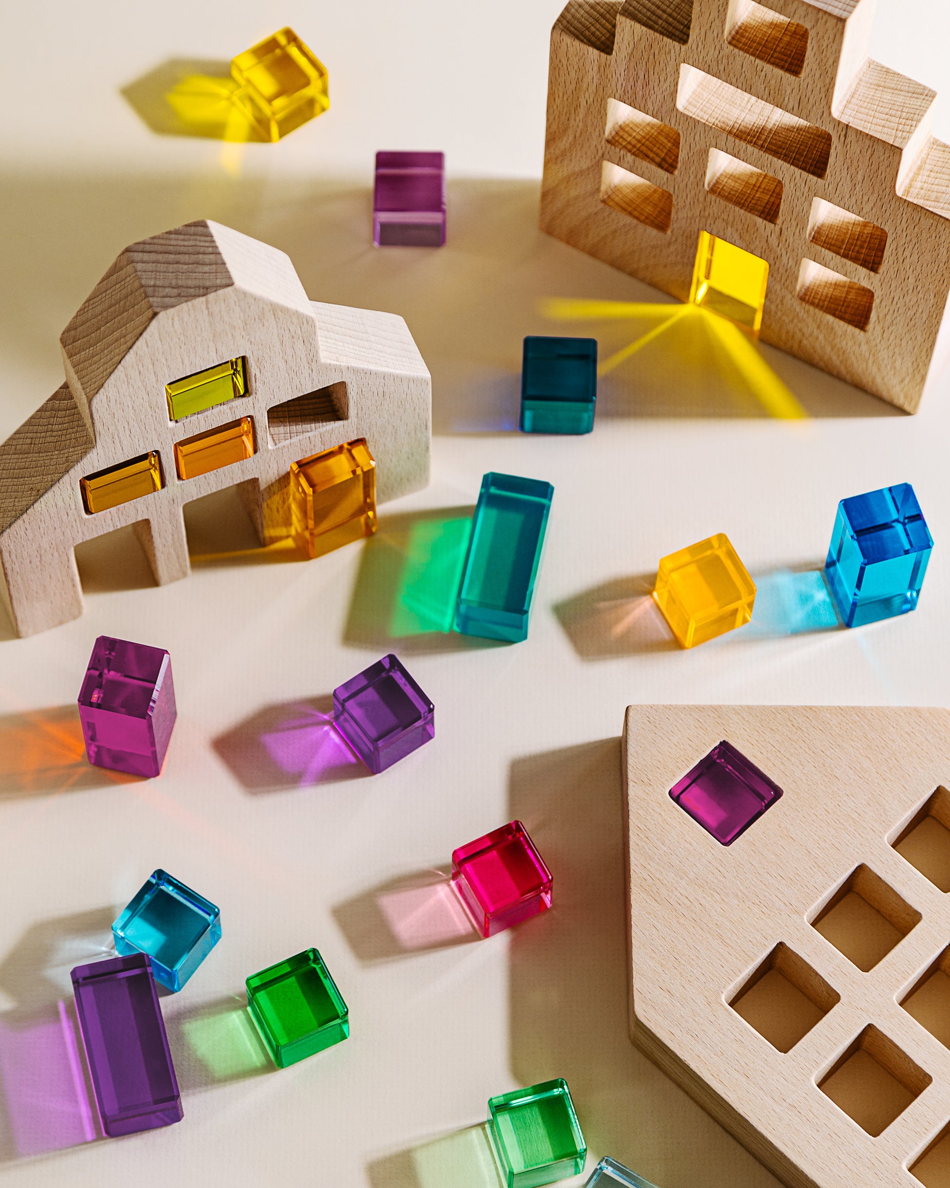 Alt Tag: Riley Blocks Digital Play Guide wooden block shapes with colorful translucent cubes for creative learning play