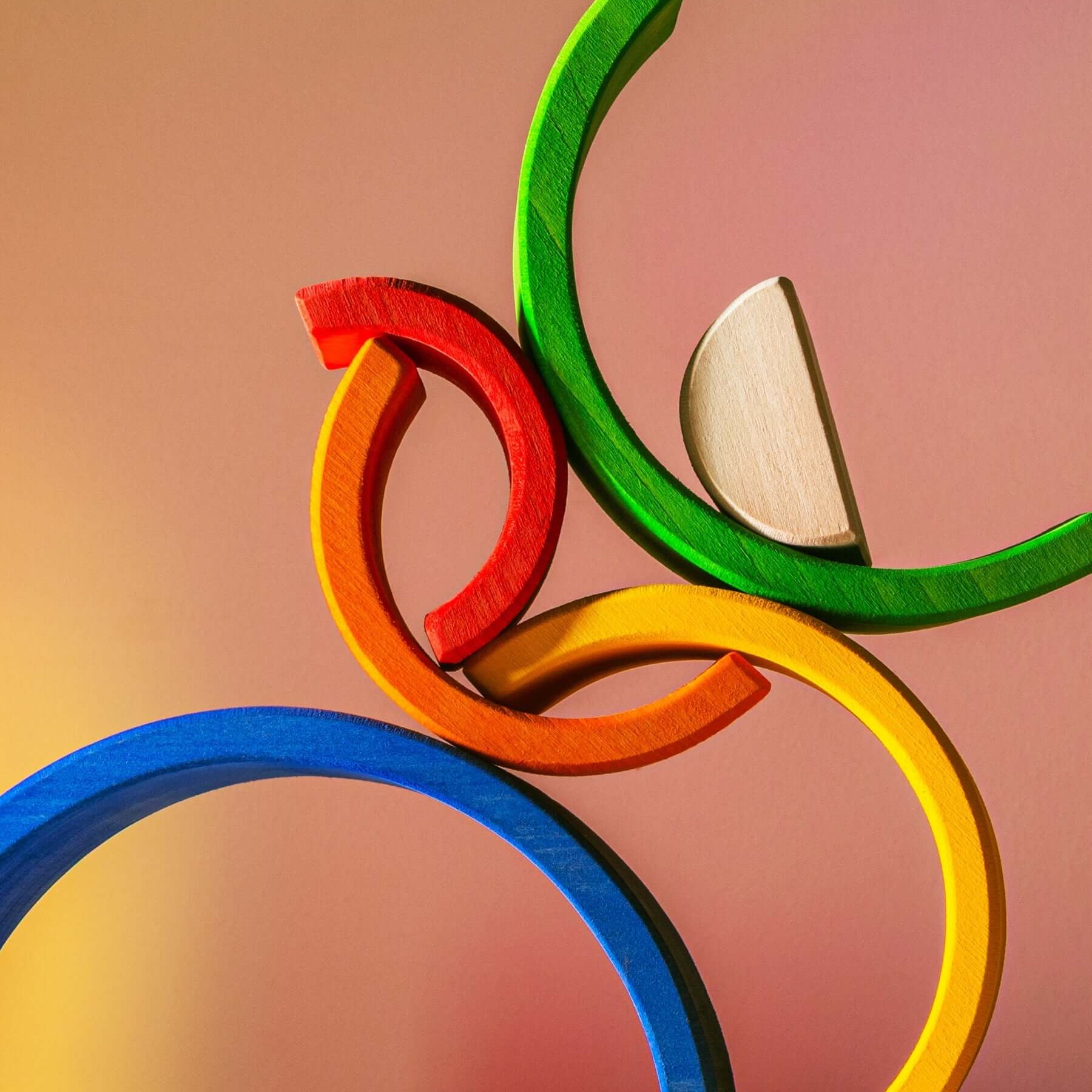 Colorful Small Wooden Rainbow stacking toy with vibrant arches for imaginative play.