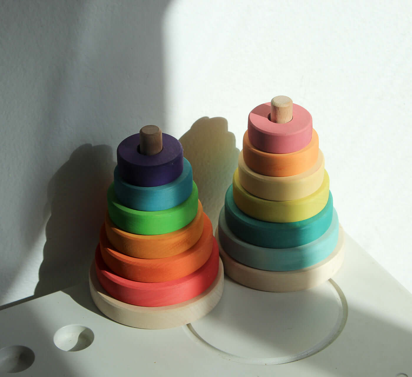 Suki Stacking Tower wooden ring stacking toy set in pastel and primary colors, toddler fine motor skills Montessori-inspired