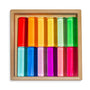 Set of colorful cylindrical objects in a wooden box on a white background